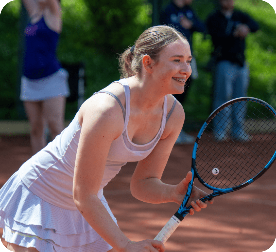 hands holding mobile phone displaying world tennis number website