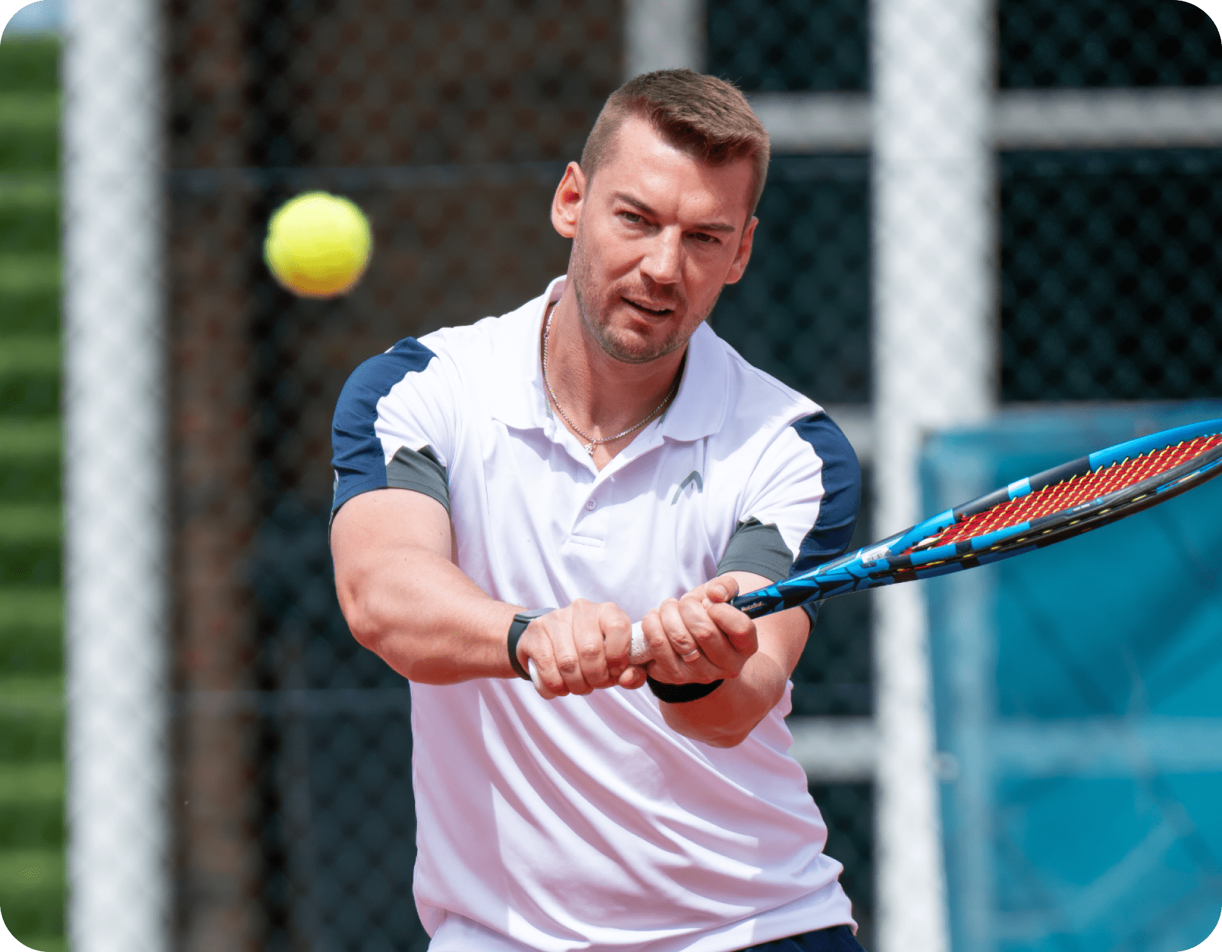 A tennis player concentrating on the ball